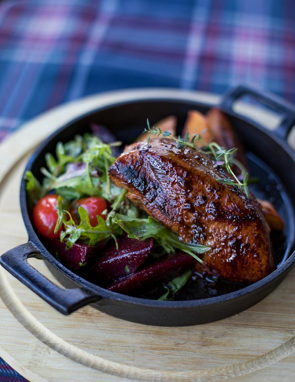 Cast iron skillet undergoing seasoning in an oven with thin, even oil layers.